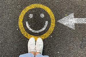 smiley face emoji painted on the road